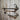 Industrial steampunk wall shelf with pressure gauge accents and pipe fittings on rustic wood