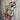 Industrial steampunk wall rack with copper pipe, red hooks, pressure gauge, and valve on rustic wood