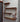 Industrial steampunk wall shelves with copper pipes, wood panels, valves, and gauges