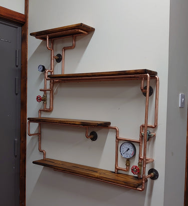 Industrial steampunk wall shelves with copper pipes, wood panels, valves, and gauges