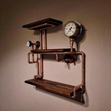 Handmade steampunk wall shelf with copper pipes, wooden planks, and vintage industrial gauges