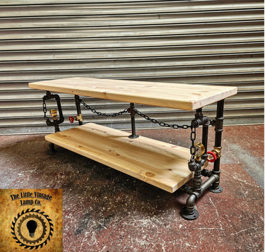 Handmade steampunk industrial table with wood shelves, black pipe frame, and metal chain accents