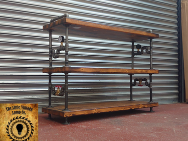 Handmade industrial steampunk pipe and wood shelving unit with gauge and valve details