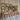 Wall-mounted metal hook rack with gears and hooks on a wooden background