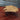 Handmade wooden coffee table in the shape of a spaceship with industrial metal legs