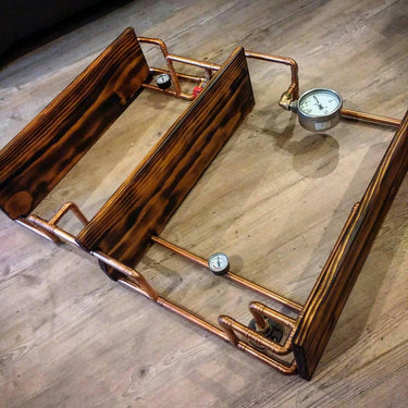 Retro industrial steampunk wall shelf with copper pipes, wood panels, and pressure gauges