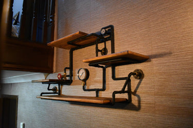 Steampunk industrial wall shelf with wood planks, metal pipes, and vintage gauges
