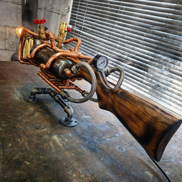 Steampunk industrial table lamp with wood stock, copper pipes, and pressure gauge on metal legs