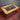 Rectangular steampunk coffee table with wood frame, glass top, and exposed metal gears.