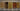 Comparison of real mahogany, walnut, oak, burnt pine, and burnt oak wood finishes on boards