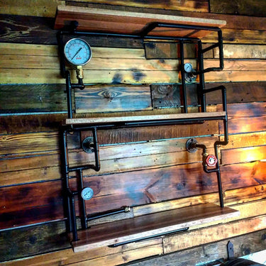 Steampunk industrial shelving unit with metal pipes, pressure gauges, and wood shelves on rustic wall