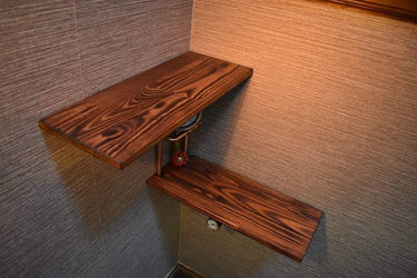 Steampunk corner shelving unit with dark wood planks and exposed pipe accents