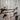 Industrial steampunk pipe towel rail and hooks with pressure gauges on rustic wood wall