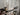 Industrial steampunk pipe towel rail with pressure gauges on rustic wood wall