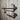 Industrial steampunk pipe shelves with pressure gauges on rustic wood wall