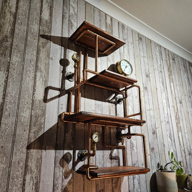 Industrial steampunk wall shelf with copper pipes, wood planks, and pressure gauges