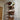 Industrial pipe wall shelf with wood planks and vintage pressure gauge, steampunk decor