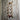 Steampunk industrial copper pipe wall decor with red valve on rustic wooden wall