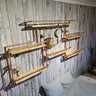 Steampunk wall shelf with copper pipes, wood planks, and vintage gauges in an industrial decor bedroom.