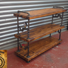 Handmade industrial shelving unit with wood shelves and metal pipe fittings, steampunk style