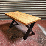 Cross Industrial Steampunk Coffee Table with a natural wood top and black X-shaped metal legs