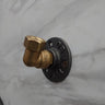 Retro industrial brass coat hook mounted on marble wall for rustic home decor