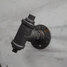 retro industrial iron coat hook with pipe fitting design mounted on a marble wall