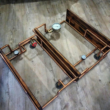 Retro industrial hardwood shelves with copper pipe frame and steampunk gauge details