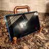 Steampunk industrial copper tablet stand on marble countertop kitchen setting
