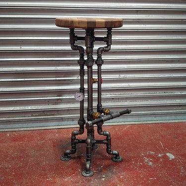 Steampunk bar stool with wooden seat and industrial metal pipe base, pressure gauge detail
