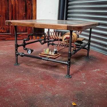 Steampunk coffee table with wooden top, industrial pipes, gauges, and vintage laboratory details