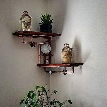 Steampunk industrial corner shelving unit with copper pipes, pressure gauge, and decor bottles