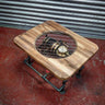 Steampunk coffee table with exposed gears and pressure gauge under glass, industrial pipe legs