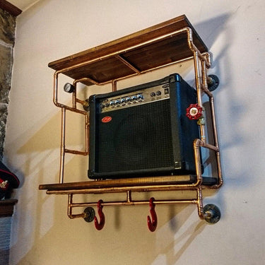 Steampunk shelving unit with copper pipes, wooden shelves, and industrial decor elements